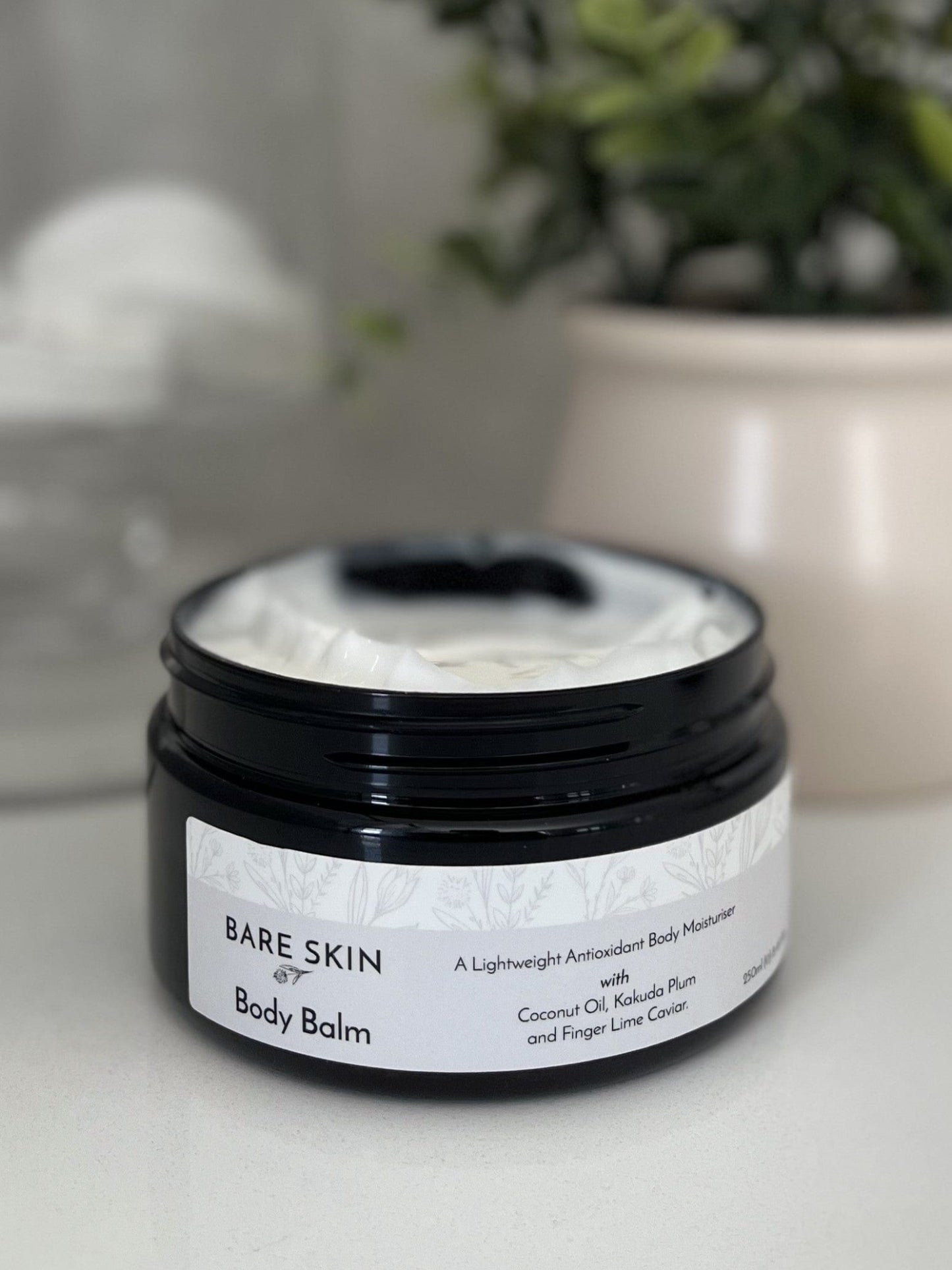 Jar of Bare Skin Body Balm on a neutral background